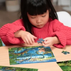 Puzzle mit 3 x 49 Teilen – Dinosaurier